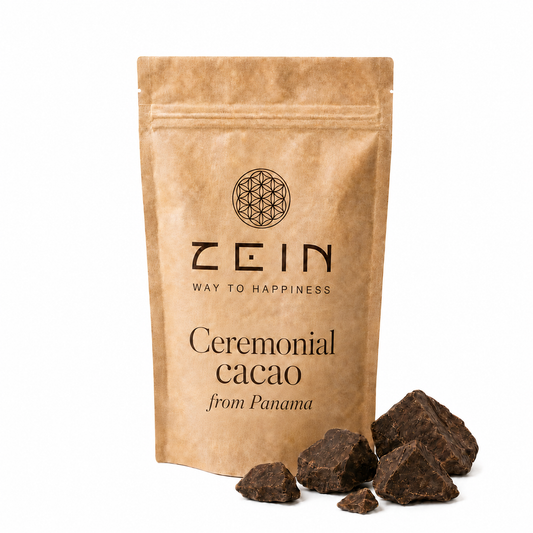 A kraft paper stand-up pouch labeled ZEIN Ceremonial cacao from Panama, shown on a white background with several dark cacao chunks placed in front.