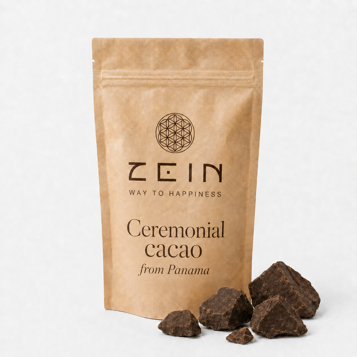 A kraft paper stand-up pouch labeled ZEIN Ceremonial cacao from Panama, shown on a light neutral background with several dark cacao pieces placed in front.